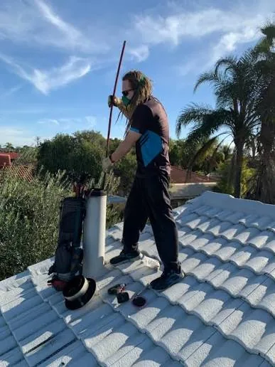 Chimney sweeping service at a residential property