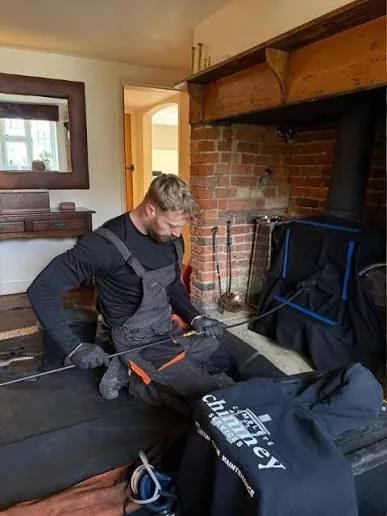 Professional fireplace cleaning in a home