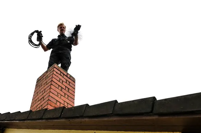 Chimney passage being checked for debris and obstructions